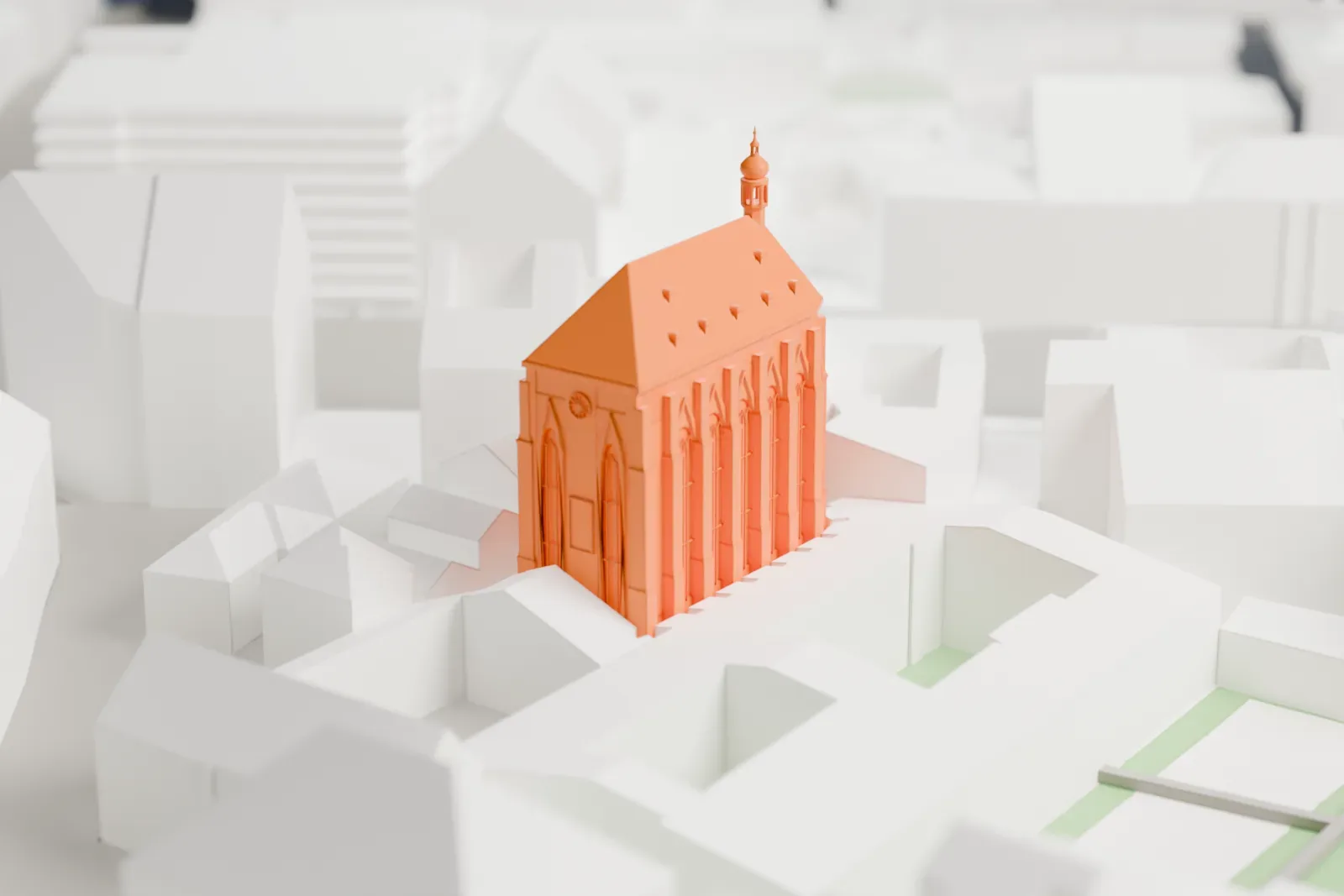 A white 3D print of the Church of Our Lady of the Snows among the surrounding streets and buildings.