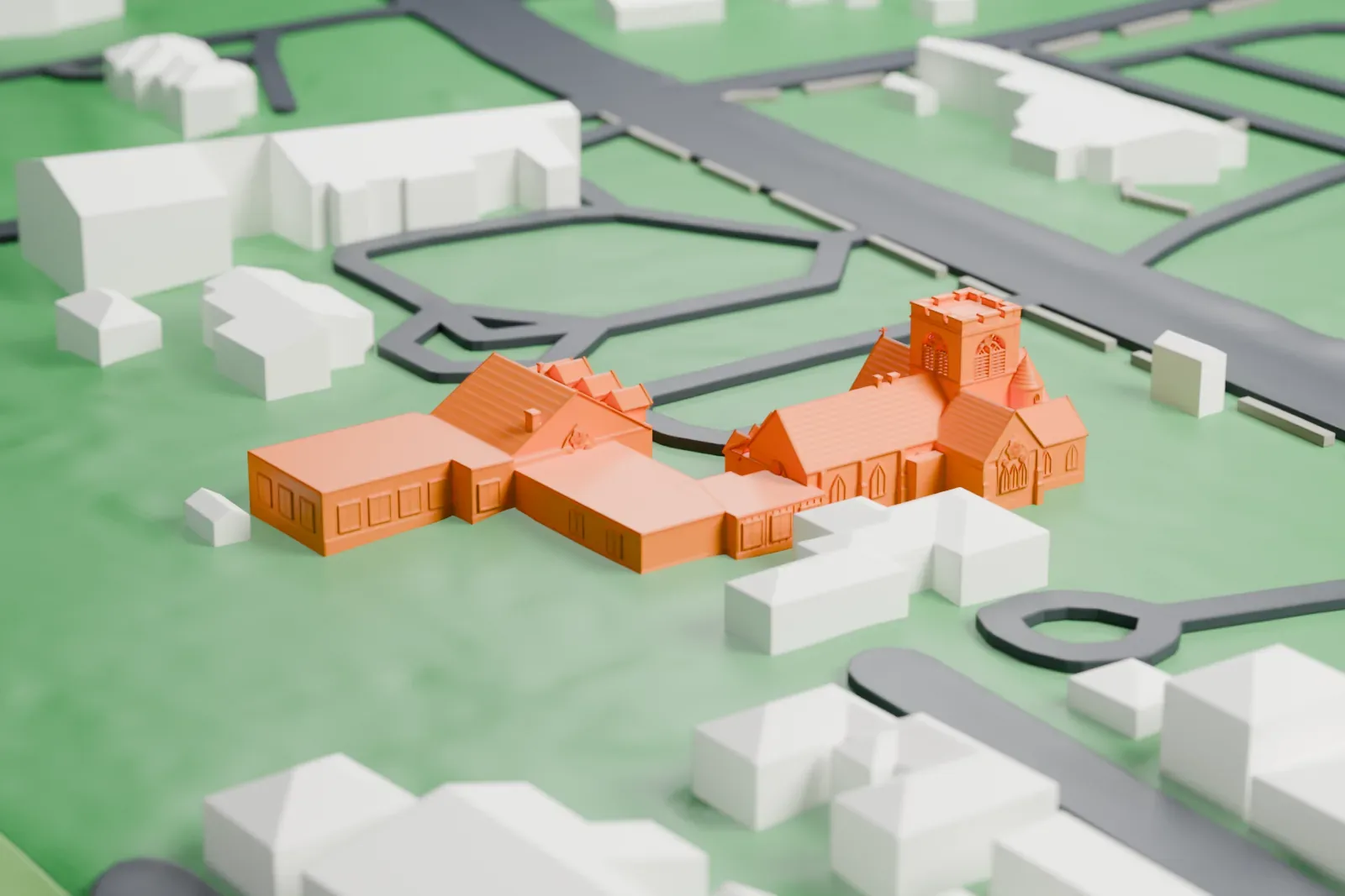 A white 3D print of the Church of St. Barnabas, a stone church with a square tower and attached wings, on a lawn with a parking loop and nearby houses.