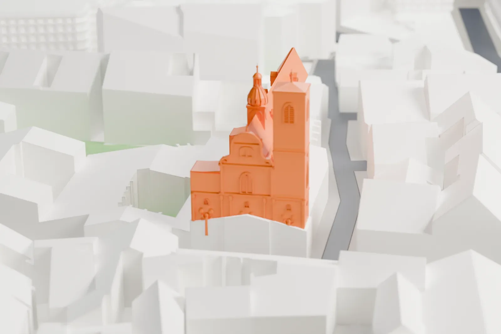 A white 3D print of the Church of St. James the Greater among the surrounding streets and buildings.