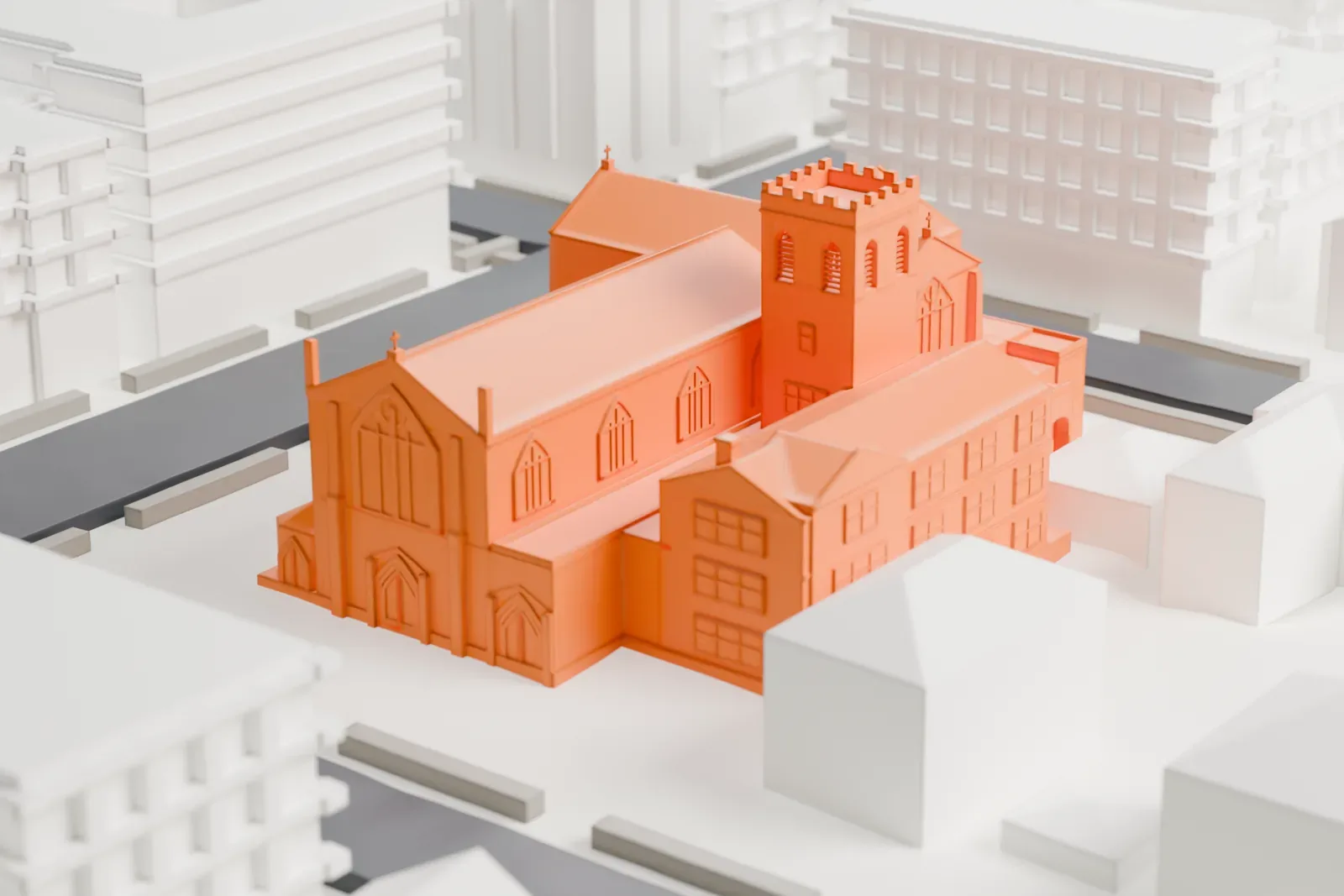 A white 3D print of the Church of the Holy Innocents, a church with a gabled nave and a square bell tower, among low buildings, mid-rise blocks and streets.