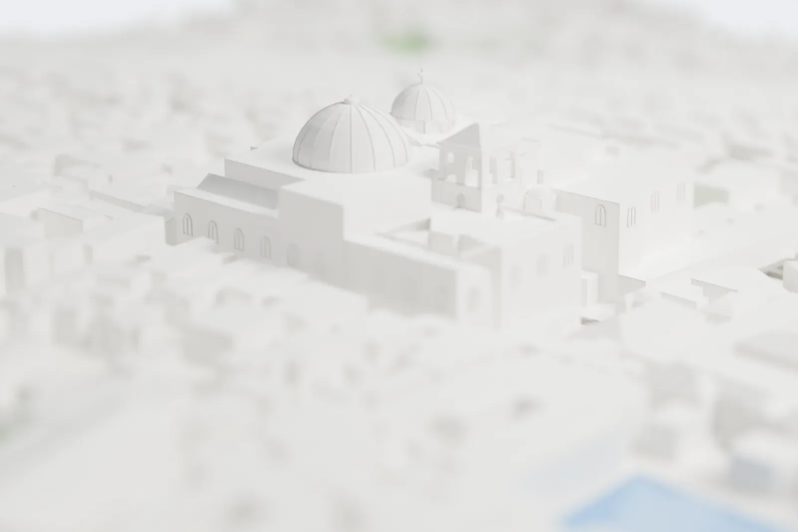 A white 3D print of the Church of the Holy Sepulchre, with two ribbed domes, a small tower and stepped roofs, surrounded by tightly packed buildings of the Old City.