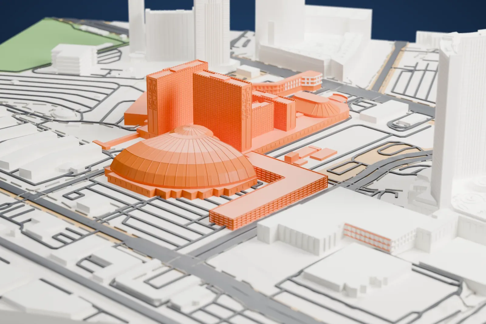 A white 3D print of Circus Circus, with its domed roofs, low wings and hotel towers, set among the surrounding buildings and streets.