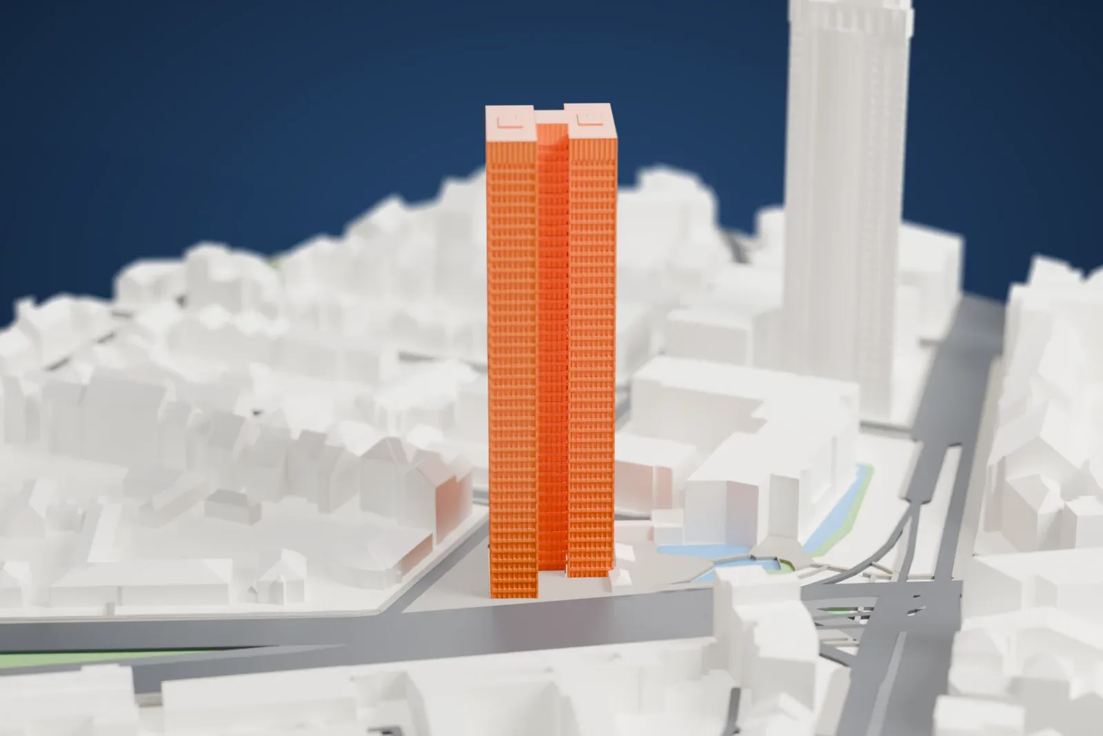 A white 3D print of City-Haus, a tall tower rising among surrounding city buildings.