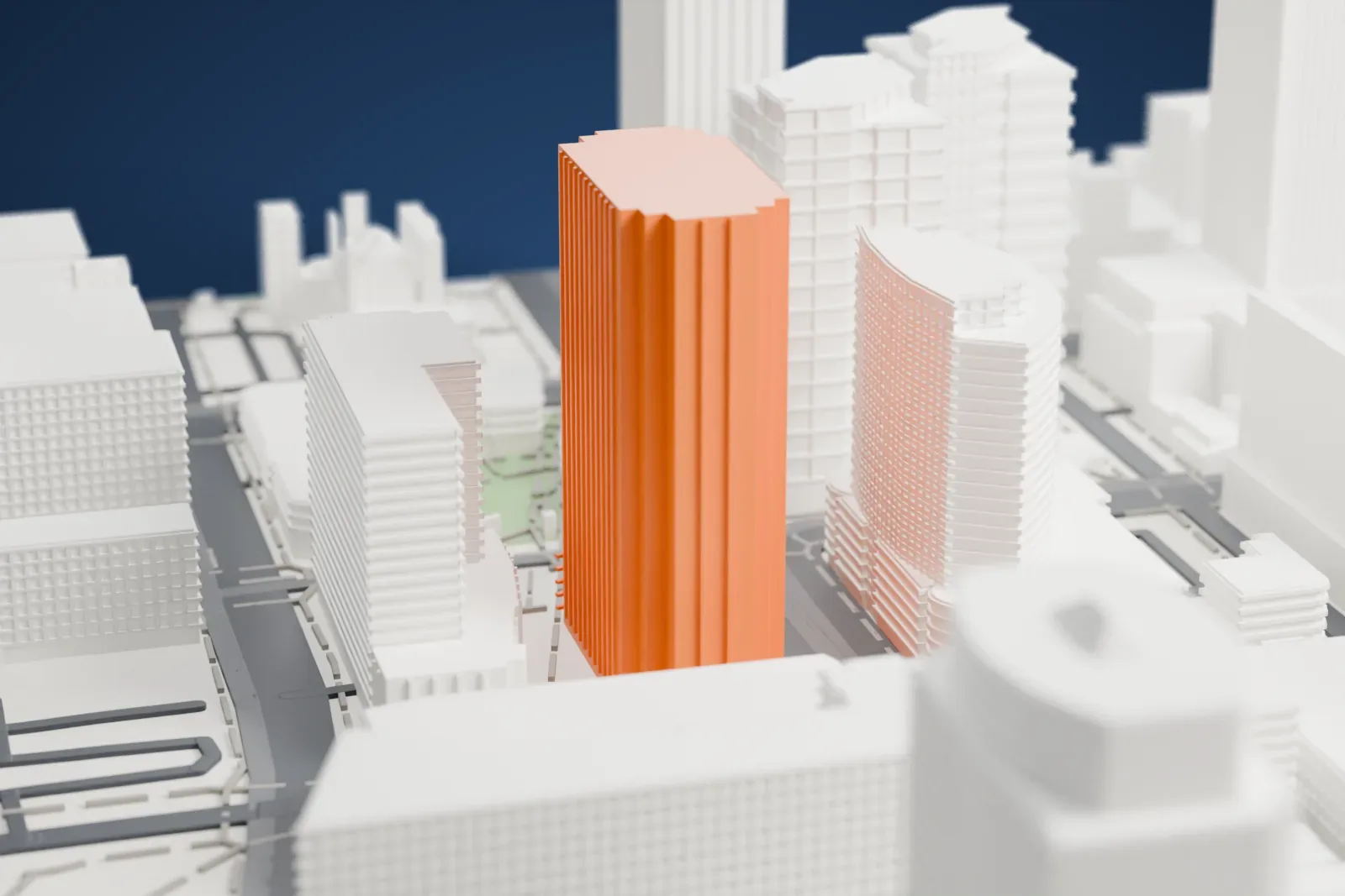 A white 3D print of CityScape Phoenix, a tall office tower and a lower retail block around a small green plaza, set among downtown towers and wide streets.