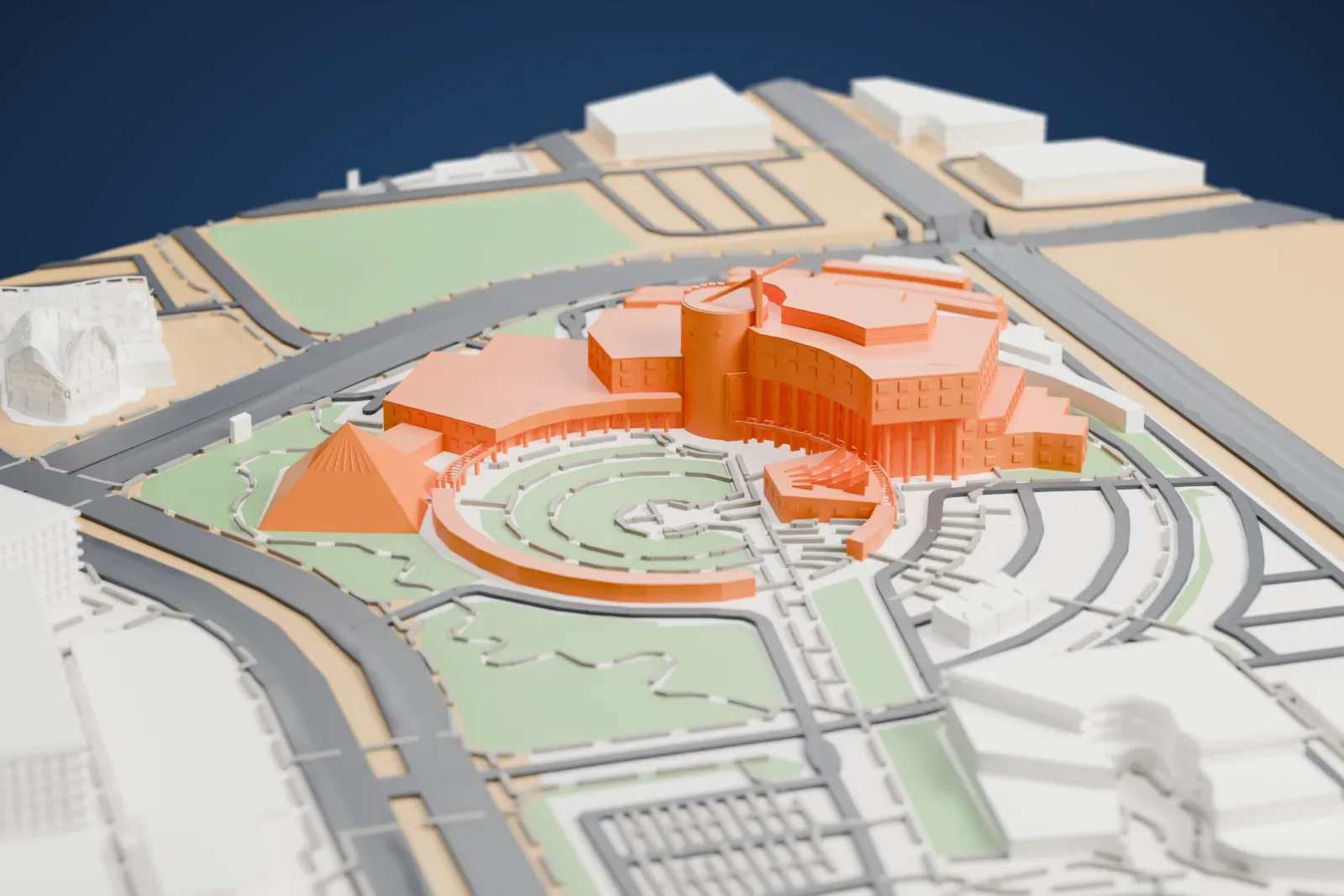 A white 3D print of the Clark County Government Center, a cluster of stepped buildings and a pyramid around a circular courtyard, with roads and lawns around it.