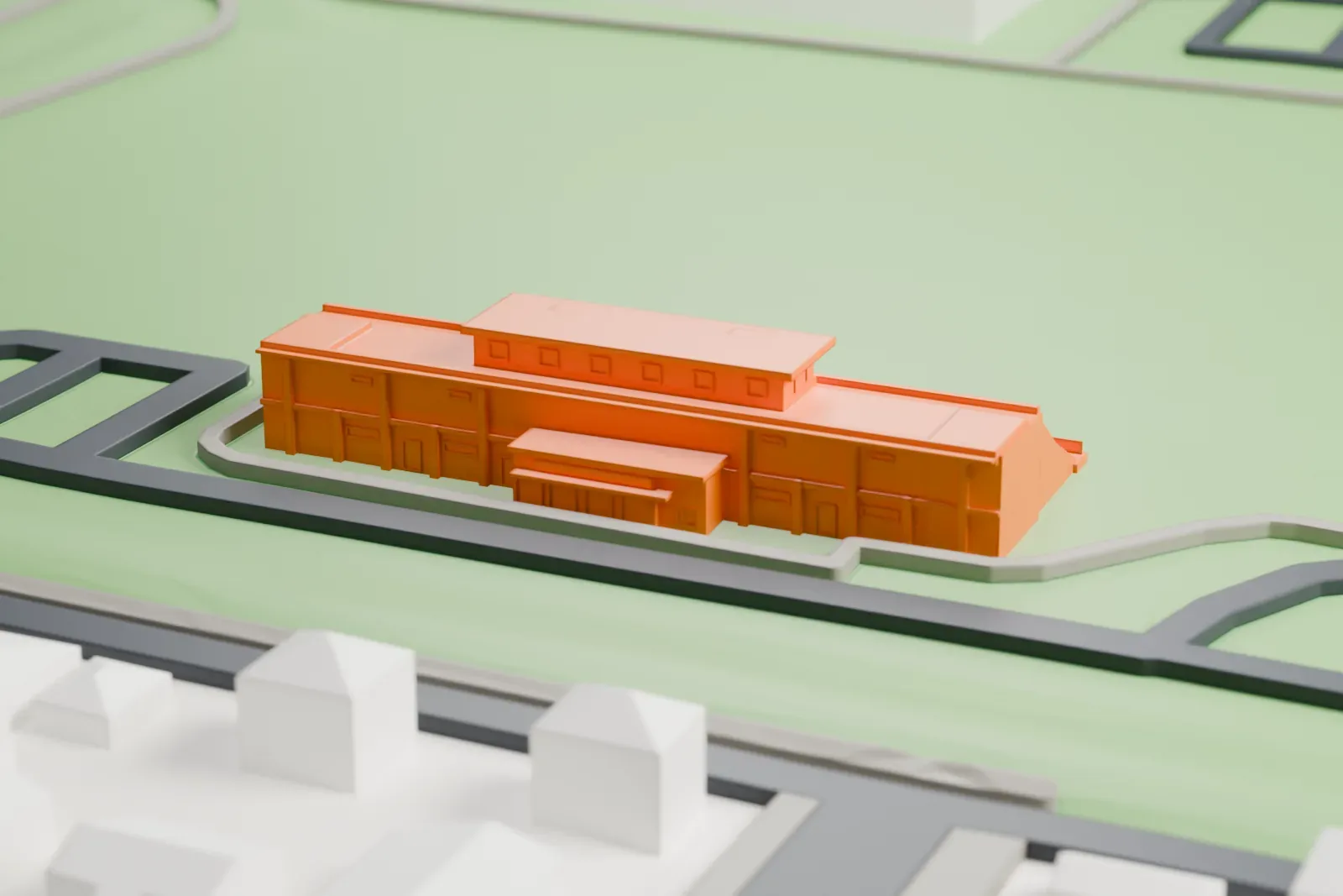 A white 3D print of Clarke Stadium with the surrounding streets and buildings.