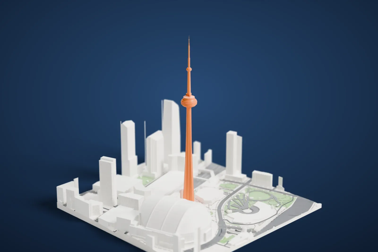 A white 3D print of the CN Tower, a very tall slender tower with a round pod near the top, standing among tall buildings, a large domed building, curving roads and green patches.