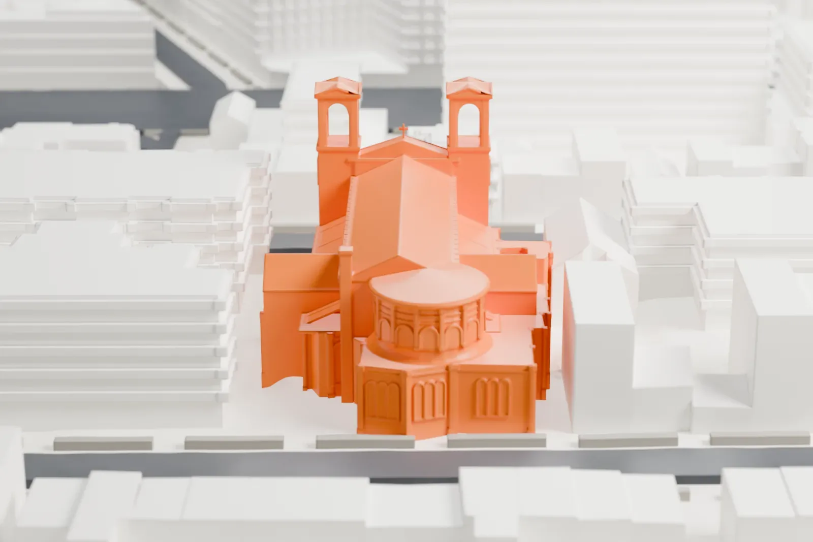 A white 3D print of the Co-Cathedral of St. Joseph, a long church with two front towers and a rounded rear end, among taller buildings and streets.