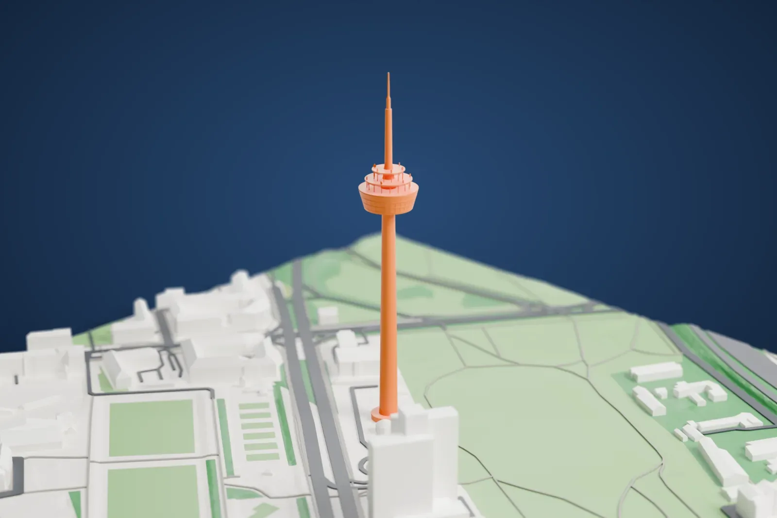A white 3D print of the Colonius in Cologne, with surrounding streets and buildings.