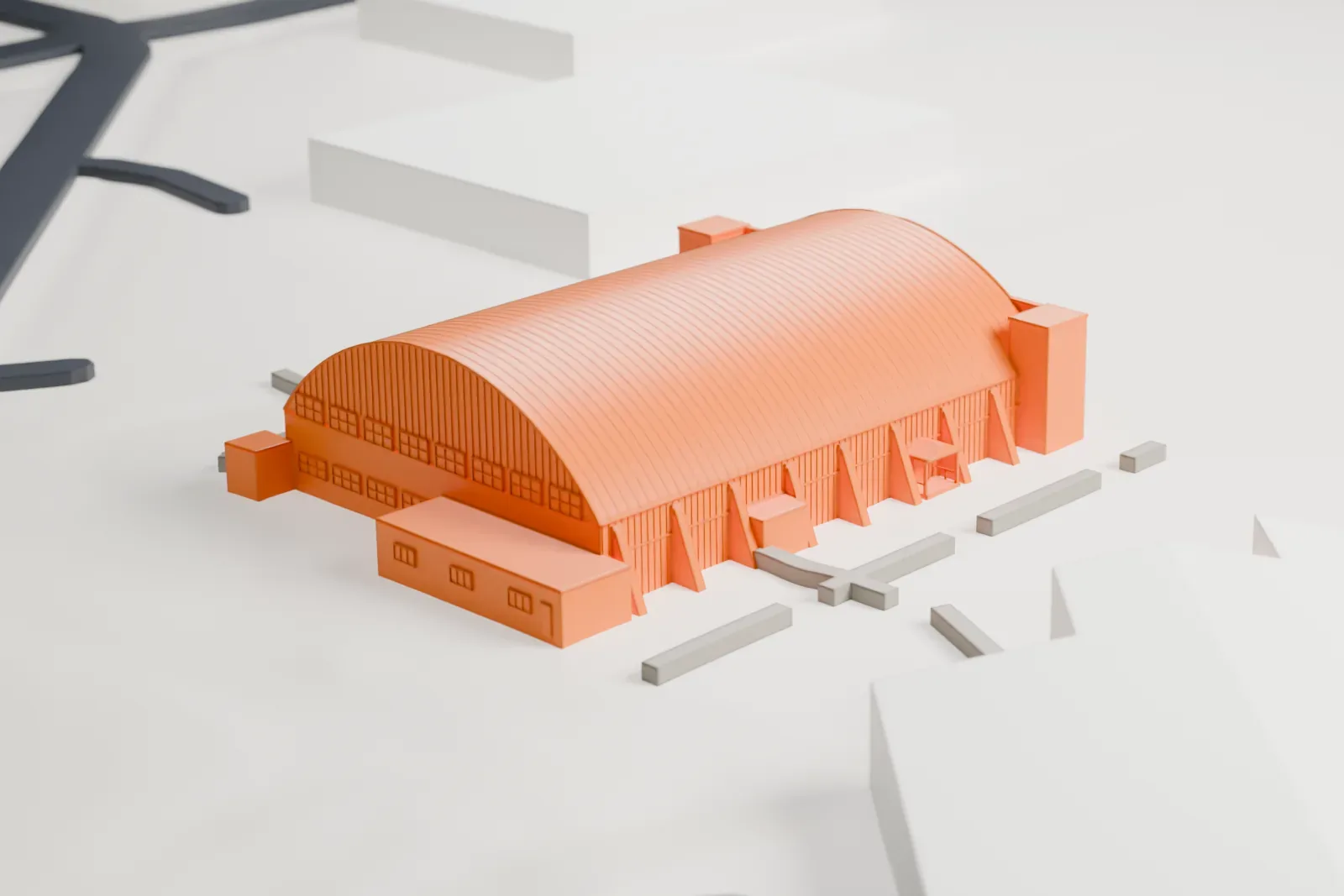 A white 3D print of the Combat Air Museum hangar, a long arched-roof building with a columned front and small side wings, on flat ground with a few nearby buildings.