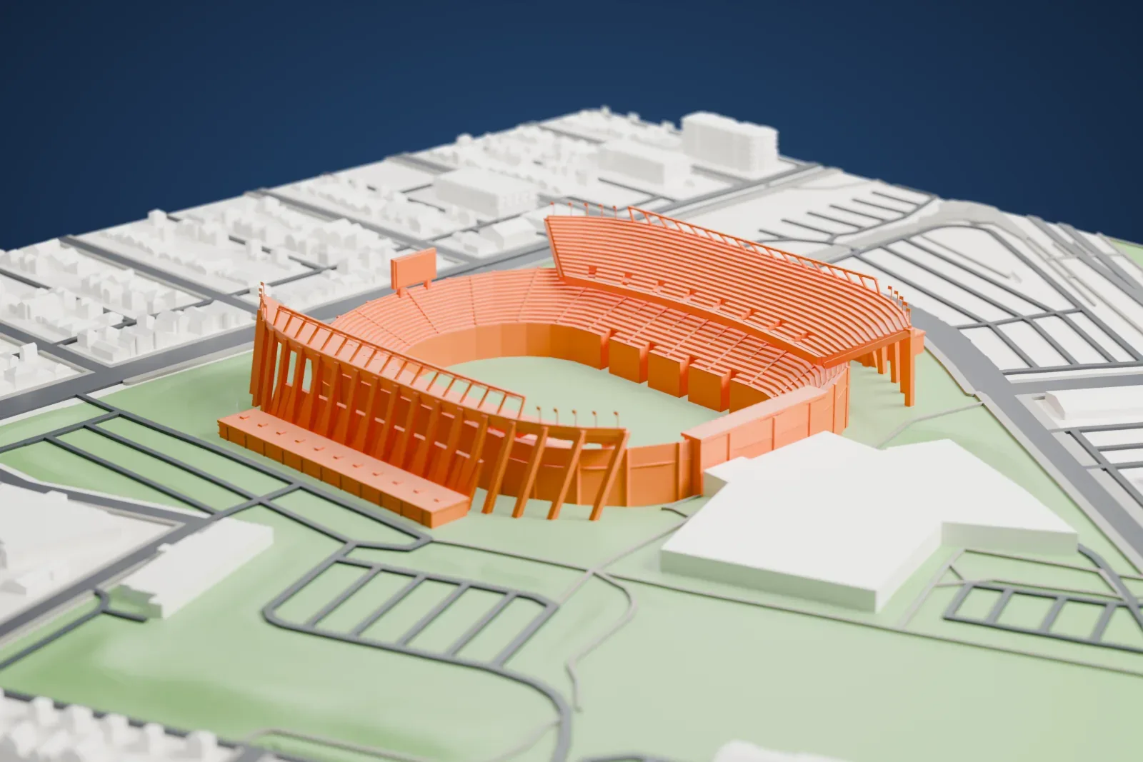 A white 3D print of Commonwealth Stadium, an open bowl with two-tier side stands and tall light banks, surrounded by the streets and buildings of Edmonton.