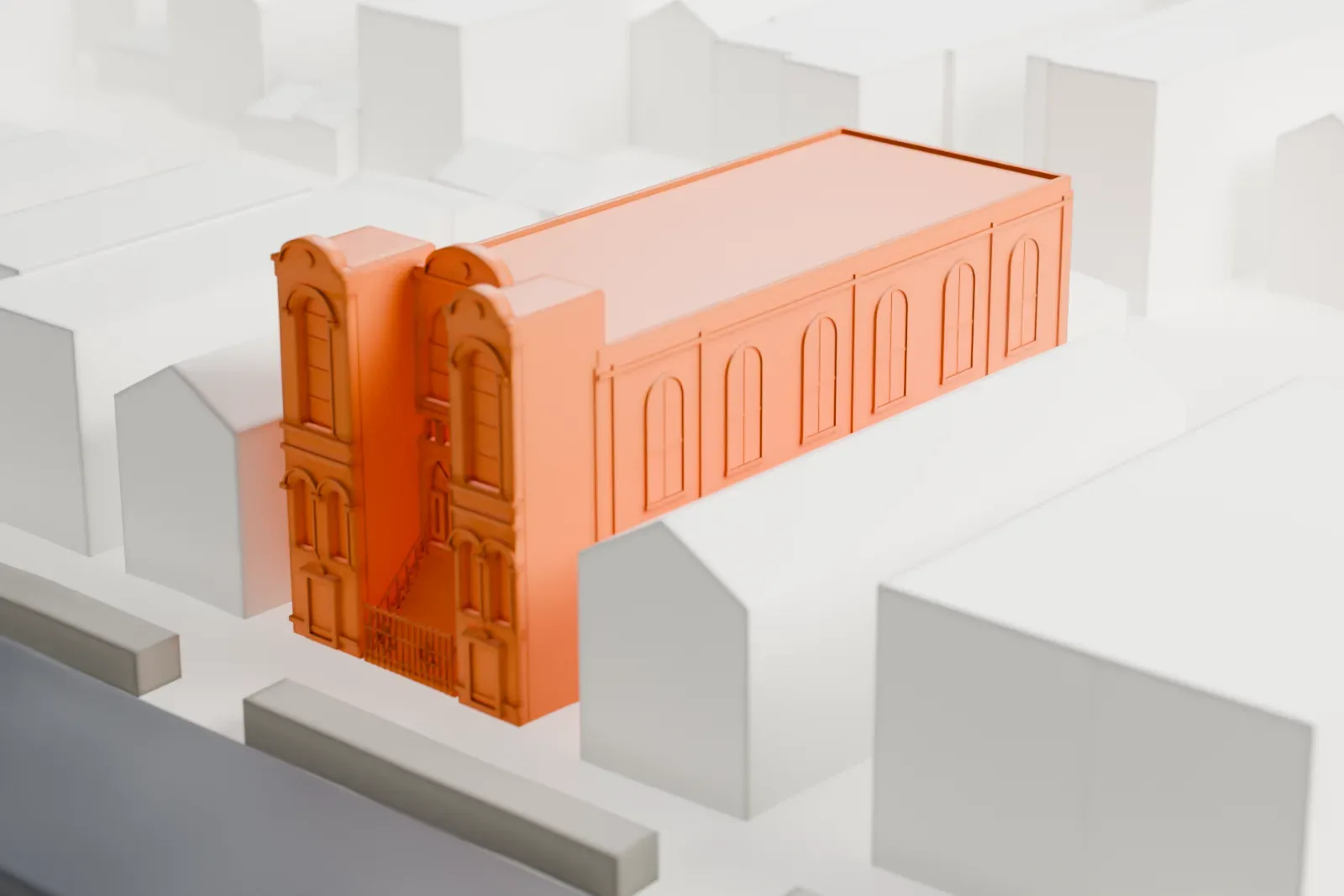 A white 3D print of Congregation Beth Israel, a two-story rectangular building with an arched front and small towers on its roofline, among gabled houses and streets.