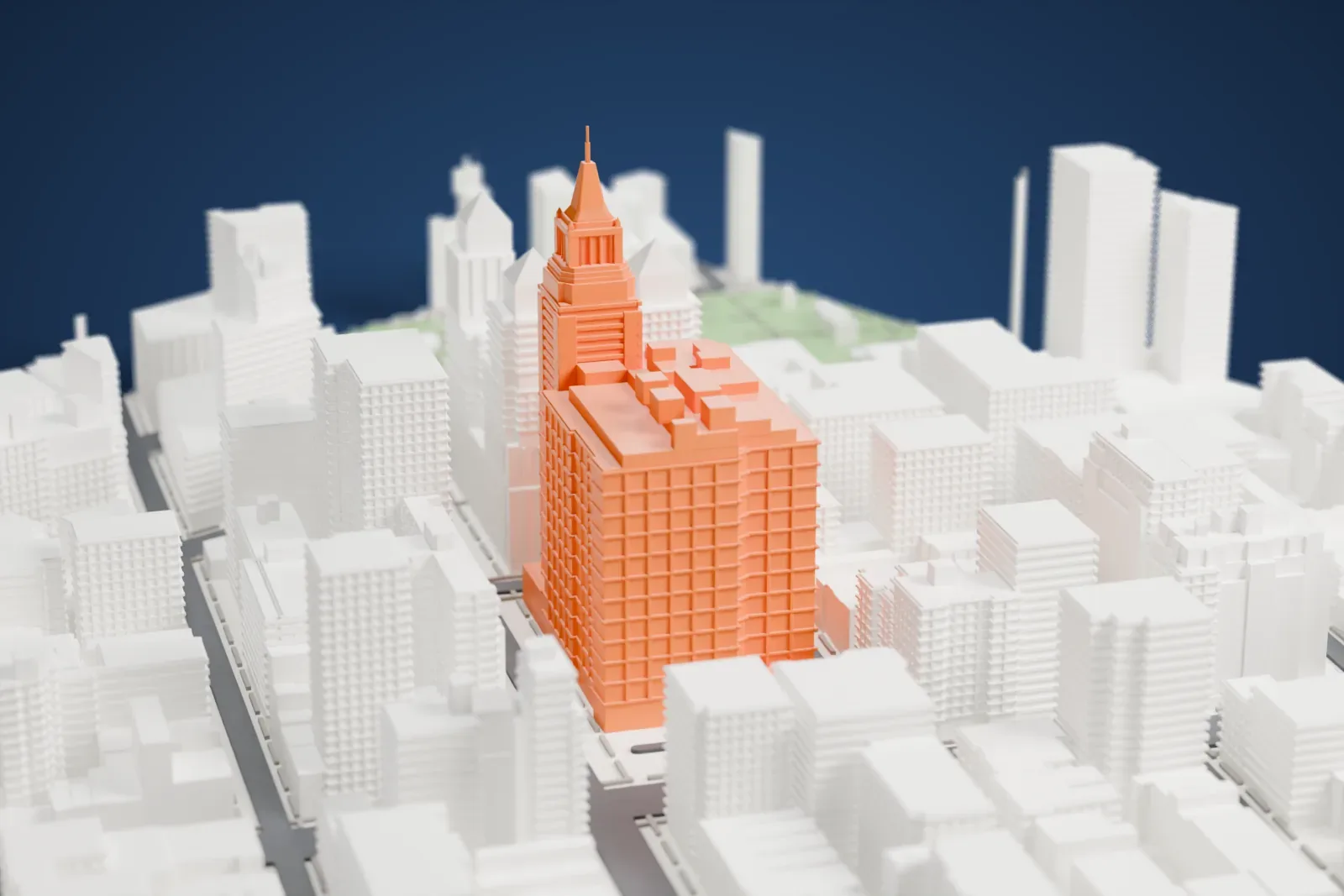 A white 3D print of the Consolidated Edison Building, a large block with a tall clock tower and many small details along the roof, among dense Manhattan buildings.