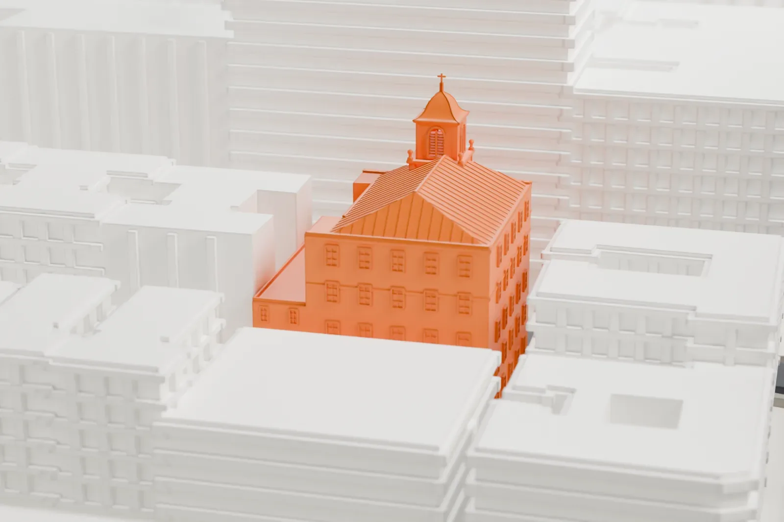 A white 3D print of Corpus Christi Church, a brick building with a ribbed pitched roof and a small cupola with a cross, surrounded by larger buildings.