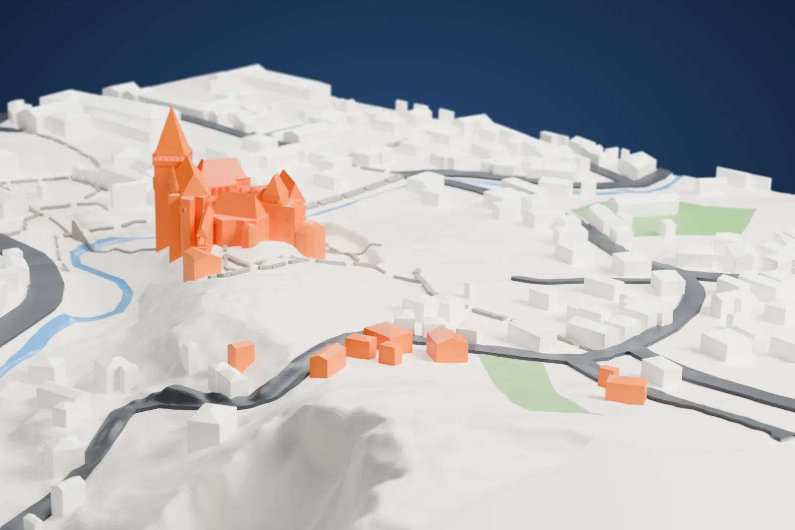 A white 3D print of Corvin Castle, a cluster of towers with tall pointed roofs and a long row of arches, on rising ground beside water, with houses and roads around it.