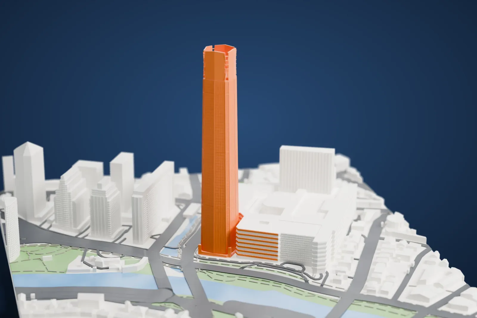 A white 3D print of the Costanera Center tower, a very tall slim tower with a notched top, rising beside a waterway and mid-rise buildings.