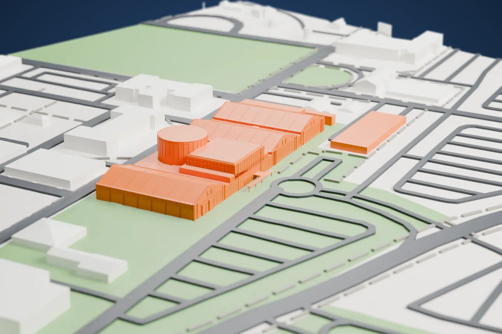 A white 3D print of the Cradle of Aviation Museum hangars, a row of long gabled roofs beside a round drum and a patterned block, set among streets, lawns and low buildings.