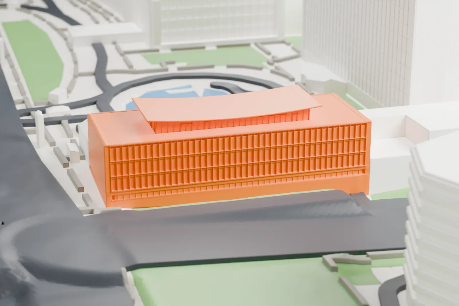 A white 3D print of the Dag Hammarskjöld Library, a low wide building beside a round pool, with taller towers around it.