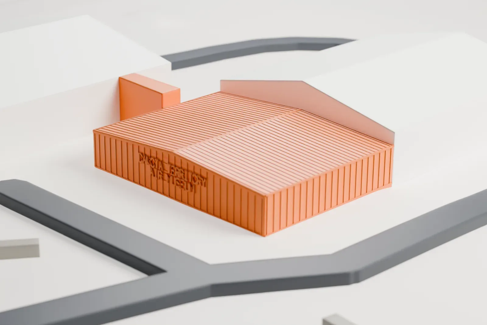A white 3D print of a hangar at the Dakota Territory Air Museum, a low gabled building with a finely patterned roof and lettering on its end wall, beside larger buildings and roads.
