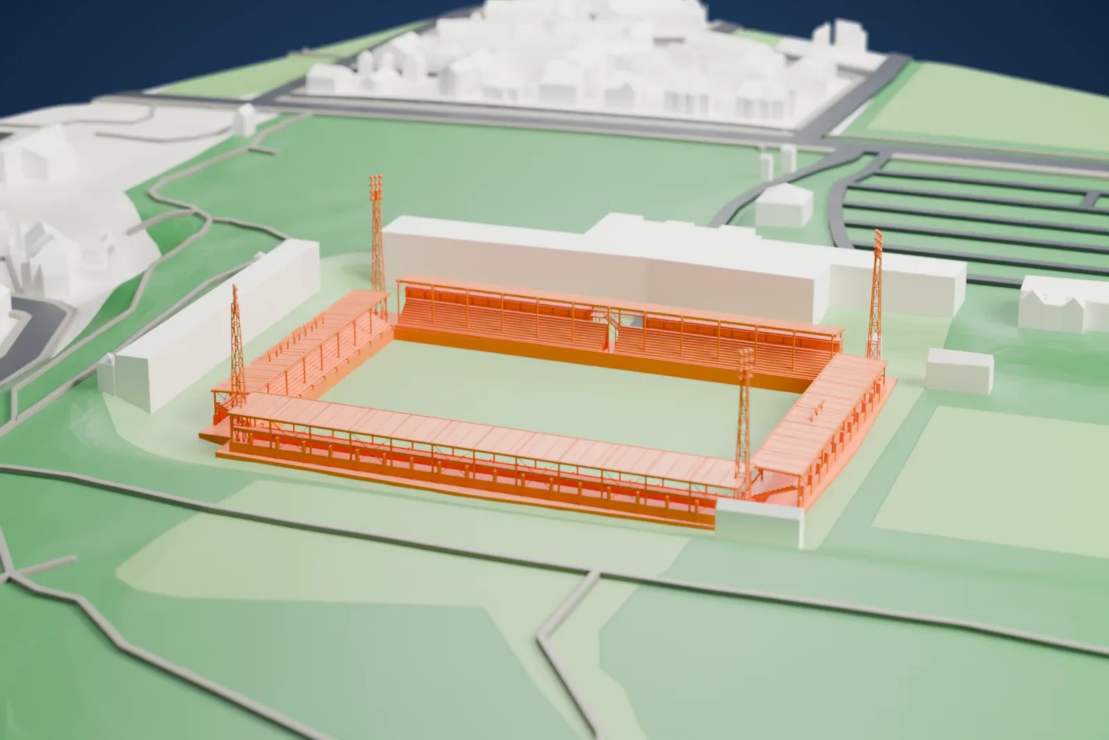 A white 3D print of De Koel, a small football stadium with covered stands on three sides and four tall floodlight masts, among surrounding grass and buildings.