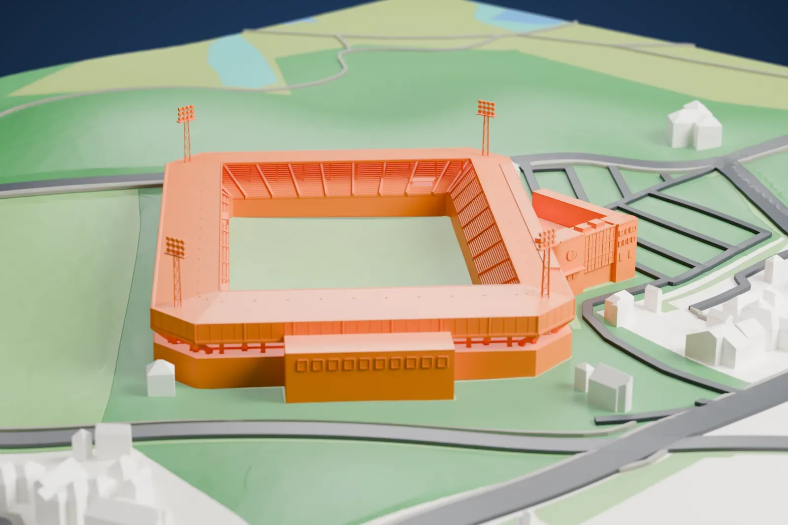 A white 3D print of Stadion De Vijverberg, a compact rectangular football stadium with roofed stands and four floodlight towers, among fields and surrounding streets.