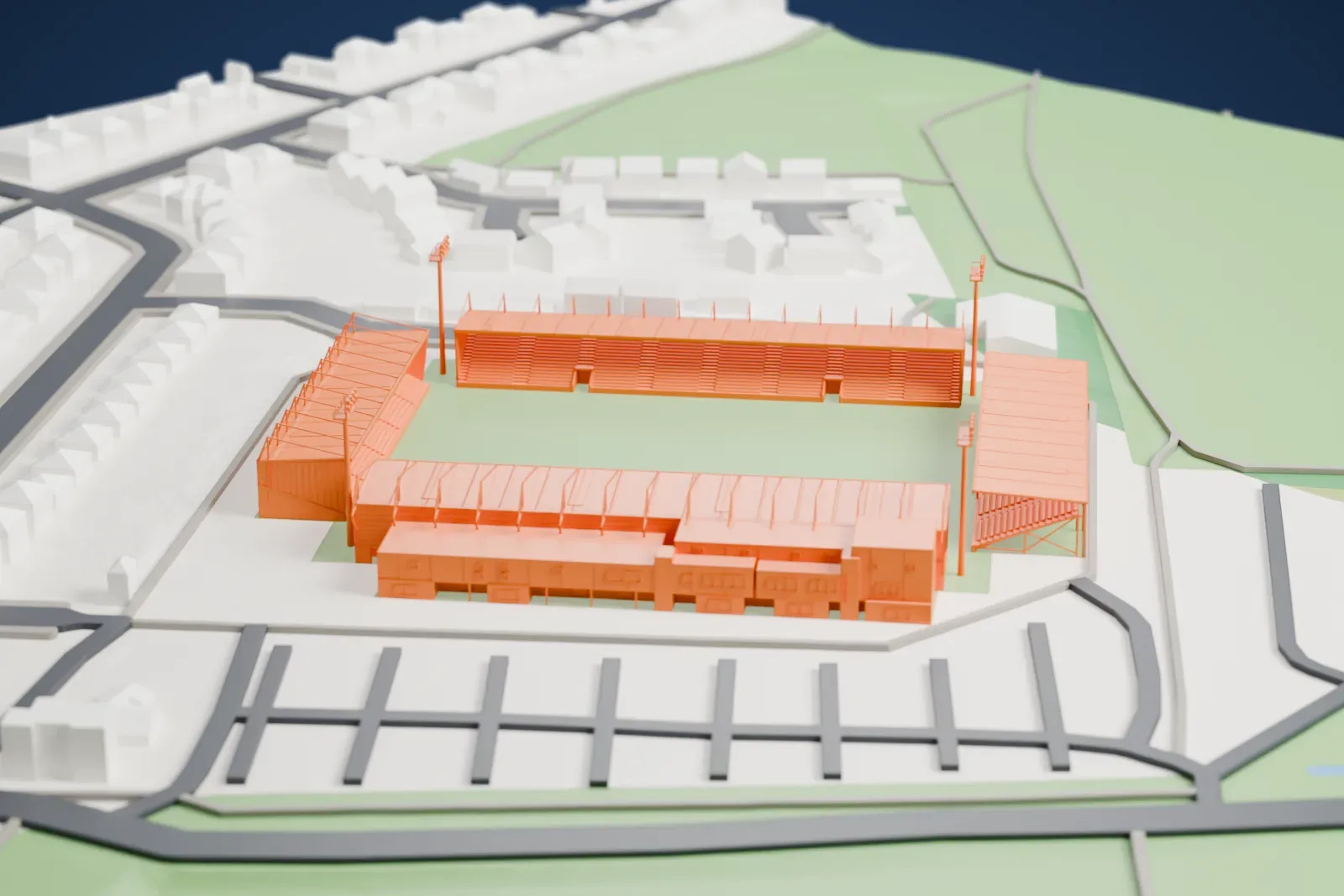 A white 3D print of Dean Court, showing four low stands around an open pitch with streets and buildings around it.
