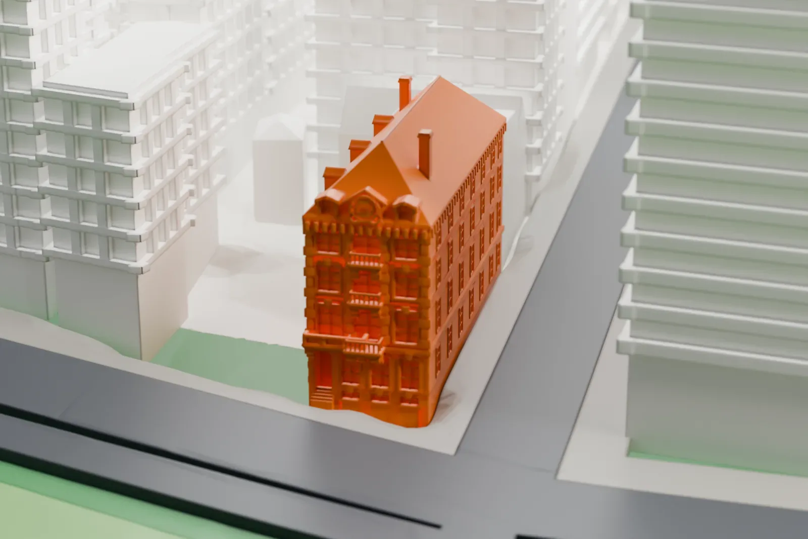 A white 3D print of the Delta Psi, Alpha Chapter building, a five-story brick house with a steep roof, squeezed between tall surrounding buildings.