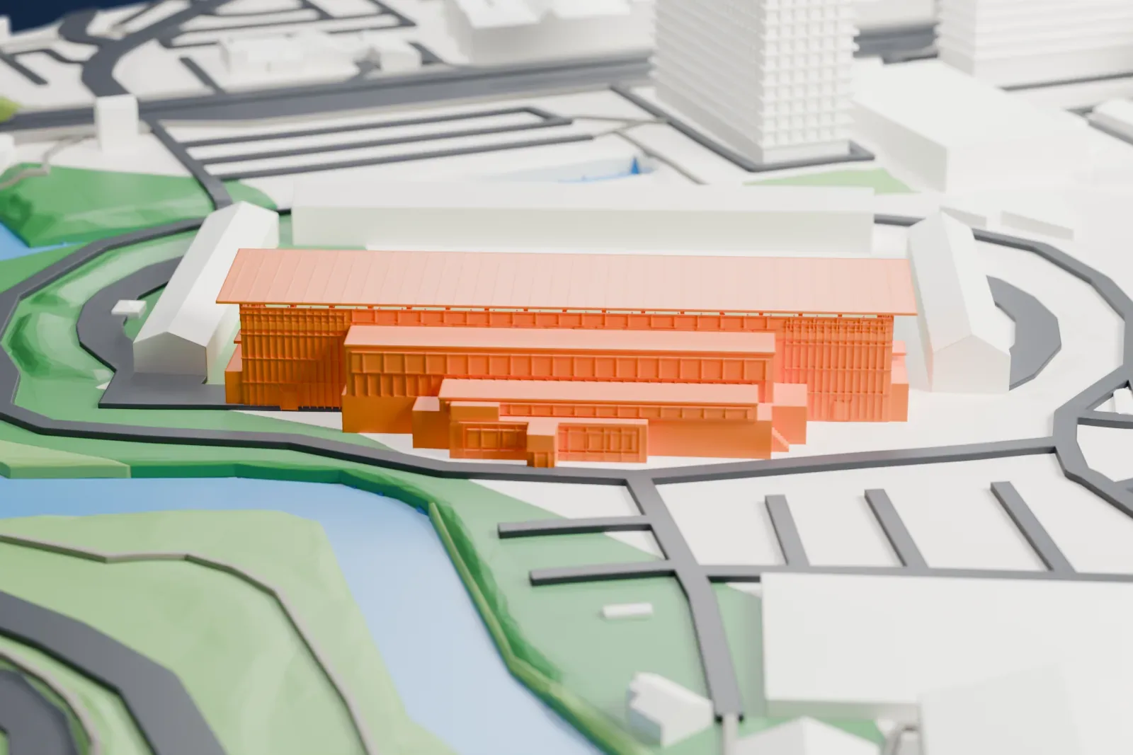 A white 3D print of the main grandstand at Den Dreef, with its long shallow roof and two banks of open seating, among surrounding streets and buildings.