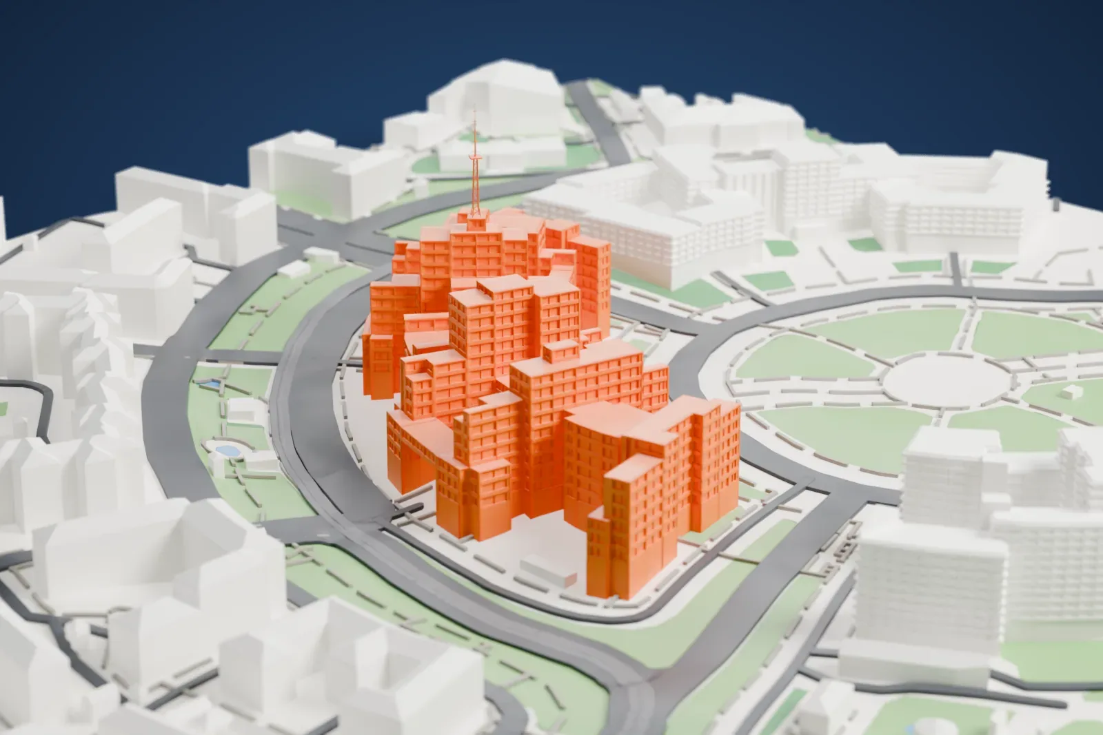 A white 3D print of Derzhprom, a cluster of stepped, boxy towers linked by overhead walkways with a slender mast on the roof, beside a round square with radiating paths.