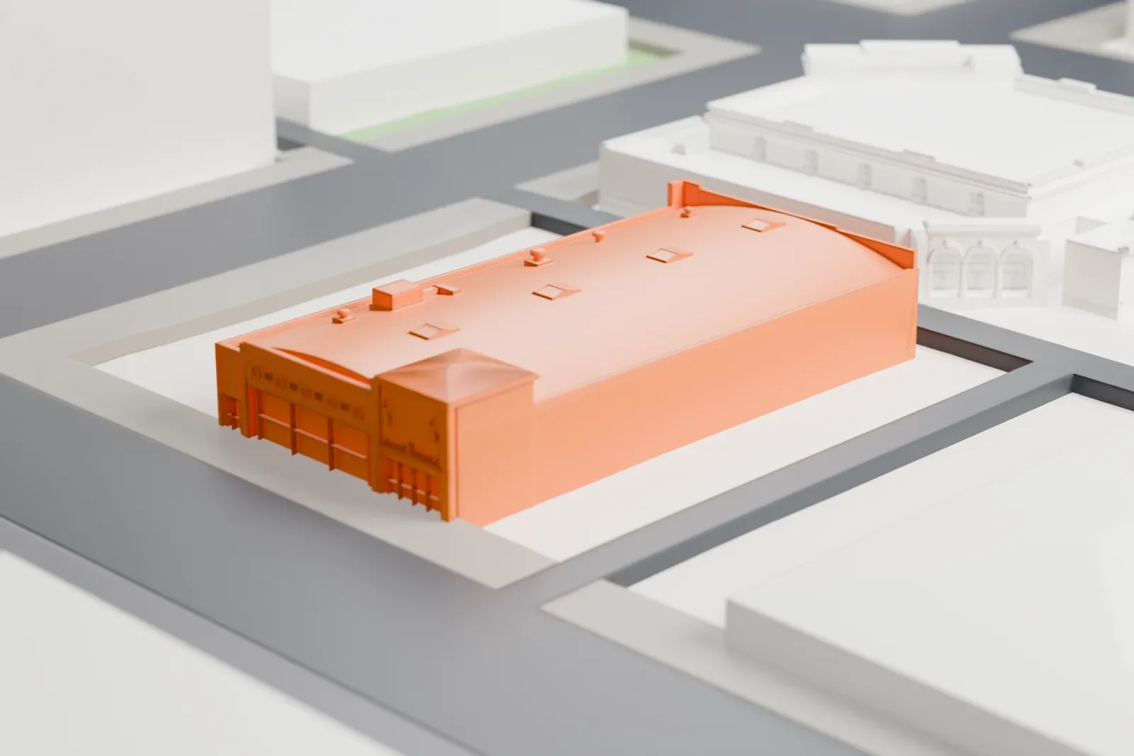 A white 3D print of the DeSoto Six Motorcars Building, a low historic building among surrounding streets and buildings.