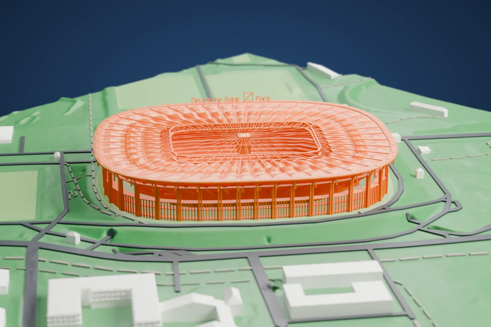 A white 3D print of the Deutsche Bank Park stadium with its broad radial roof, surrounded by roads, paths, open grounds, and nearby buildings.