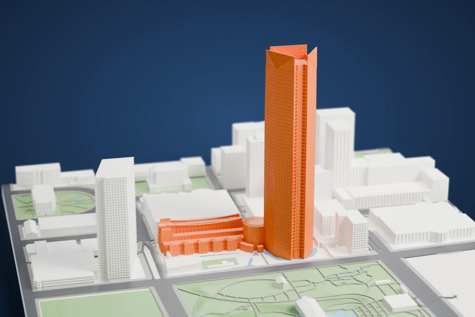 A white 3D print of the Devon Energy Center, with its faceted tower, rounded rotunda and stepped podium standing among the buildings of downtown Oklahoma City.