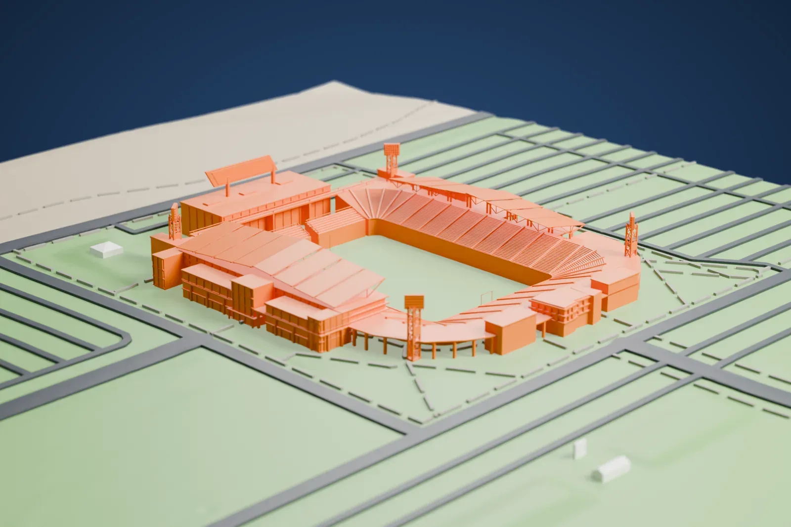 A white 3D print of Dick's Sporting Goods Park, a soccer stadium with a canopy over one stand and slim towers at the corners, set in open green ground with roads around it.