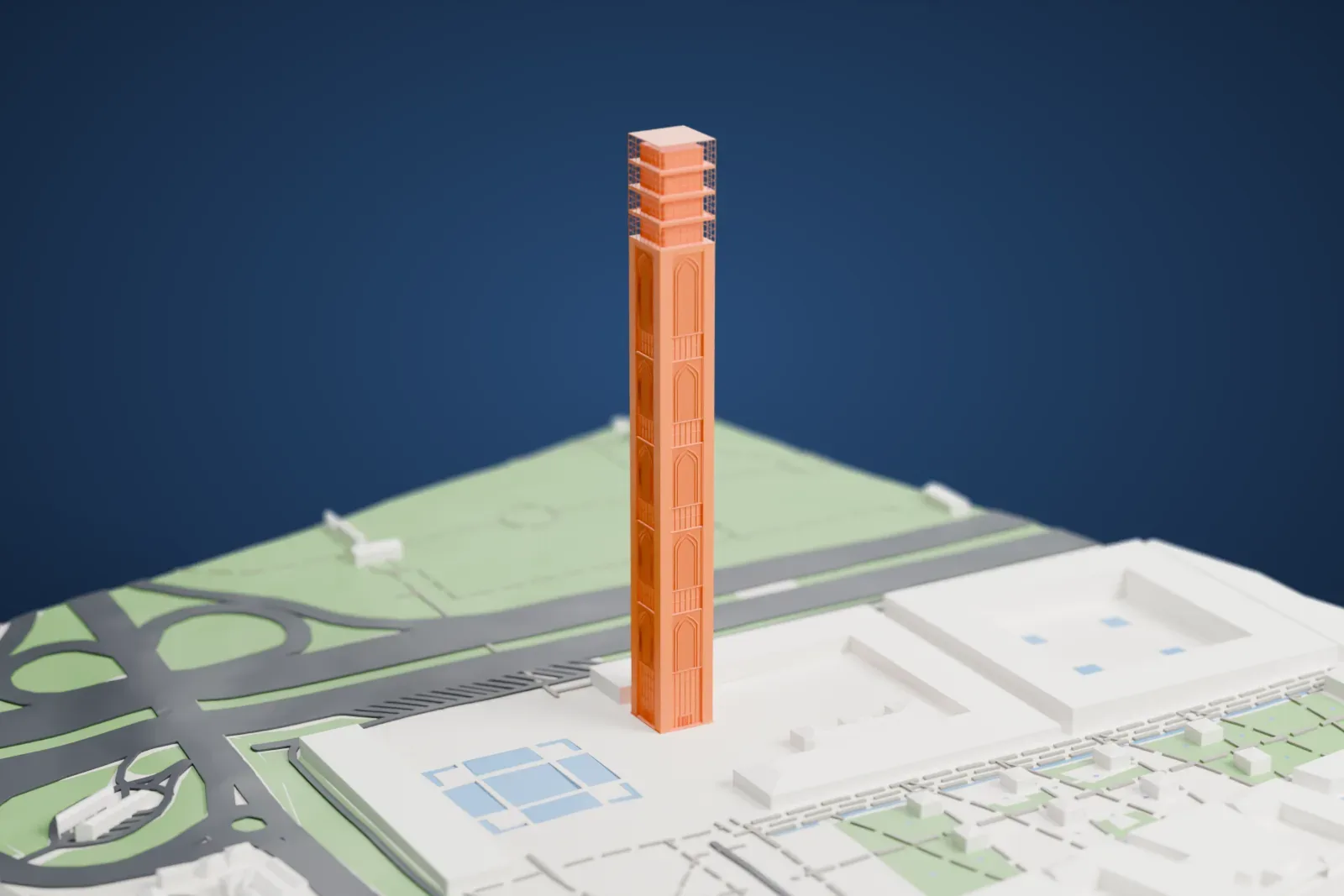 A white 3D print of the Djamaa el Djazaïr minaret, a tall square tower with open grid stages near the top, standing among parkland, roads and low buildings.