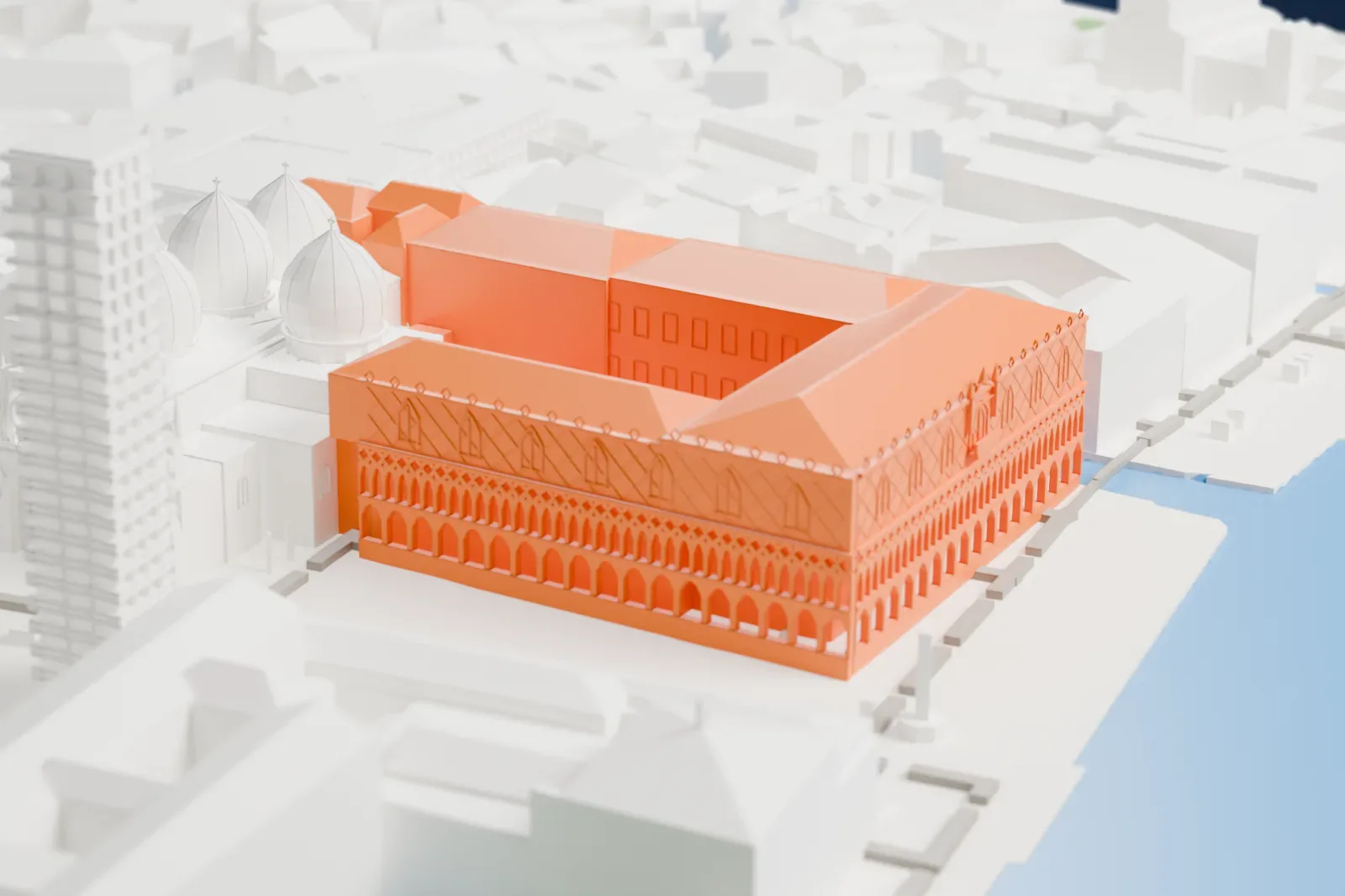 A white 3D print of the Doge's Palace, a large block-shaped palace with arcaded facades, standing beside a group of domes on a waterfront edged by water and tightly packed buildings.