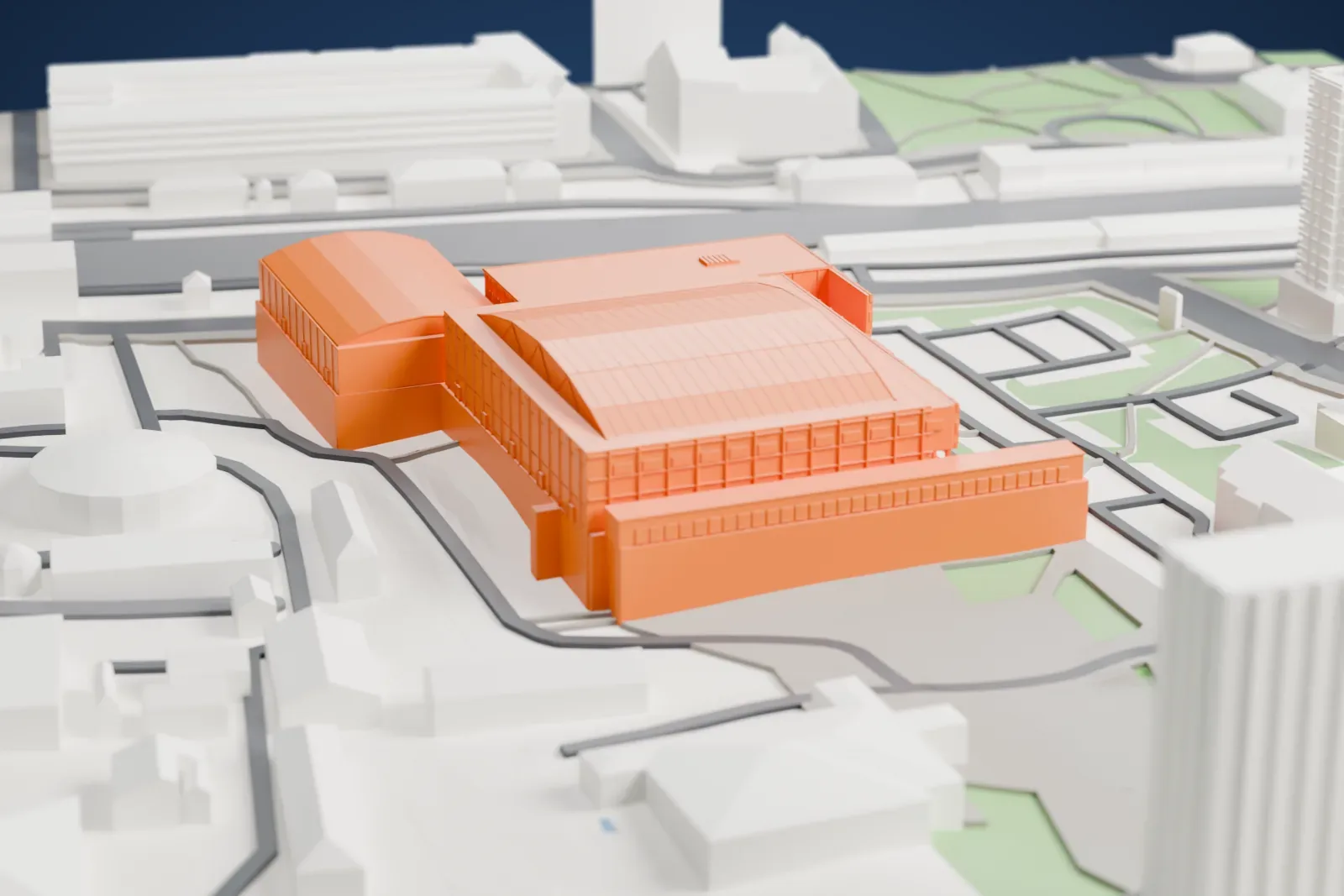 A white 3D print of Dom Sportova, a large indoor arena with a broad shallow roof and a lower wing beside it, among the surrounding streets and buildings.