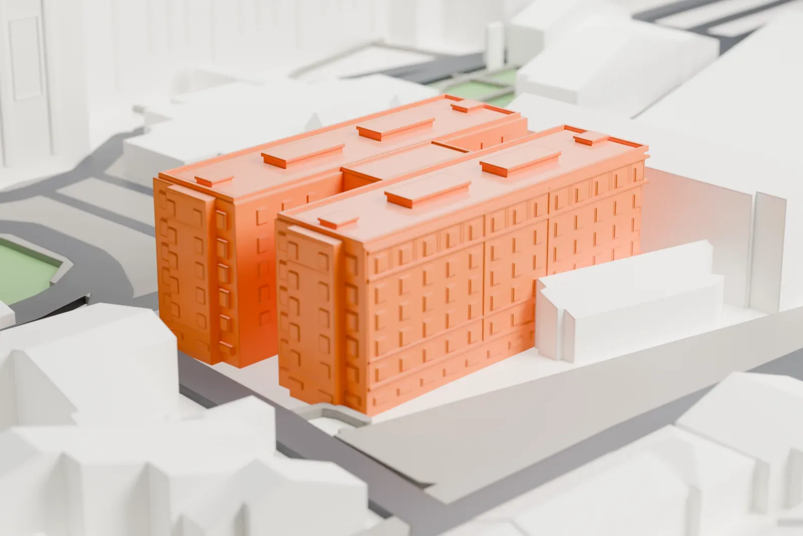 A white 3D print of the Domus Sanctae Marthae, a low guest house, standing among the surrounding buildings.