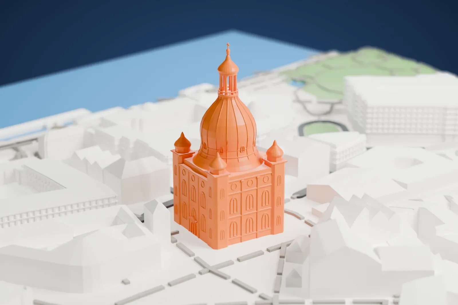 A white 3D print of the Dresden Frauenkirche, a church with a large ribbed dome topped by a slender lantern and four small corner turrets, surrounded by closely packed buildings and a square.