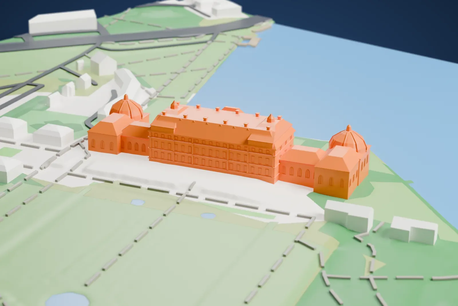 A white 3D print of Drottningholm Palace, a long palace with a tiered roof and two domed pavilions at its ends, set on green lawns beside a wide stretch of water, with garden paths and a few small buildings.