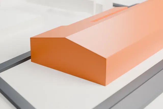 A white 3D print of the Duebendorf aircraft hangar model in Zürich, with the streets around it.