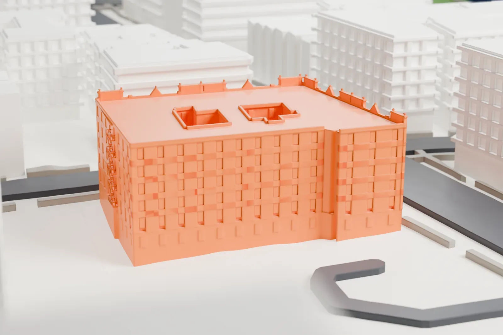 A white 3D print of the Duke Ellington House, a six-story apartment building with an ornate roofline, beside open lots and streets.