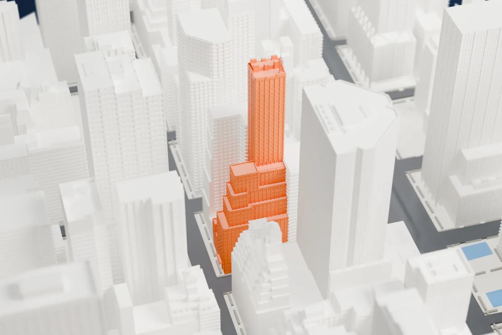 A white 3D print of the DuMont Building, a tall tower with a slim antenna spire on top, surrounded by taller and shorter Midtown skyscrapers.