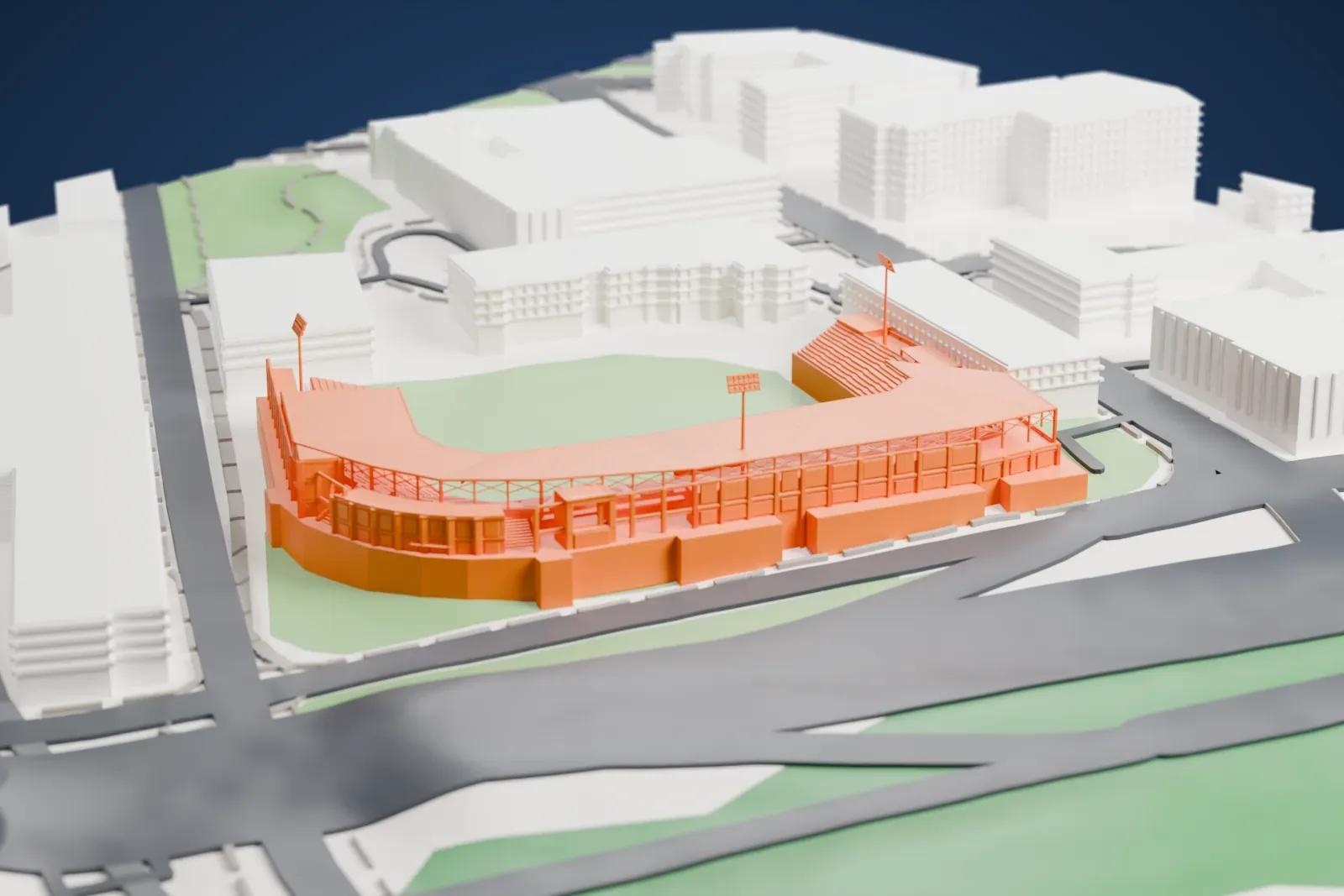 A white 3D print of the Durham Bulls Athletic Park model with a field, stepped seating, roof, and light poles, surrounded by buildings and streets.