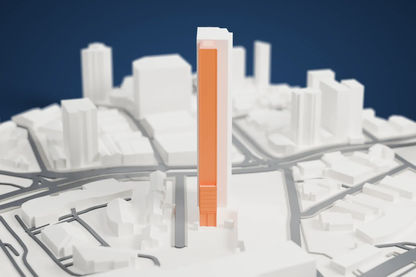 A white 3D print of E-Tower rising above the surrounding streets and buildings.