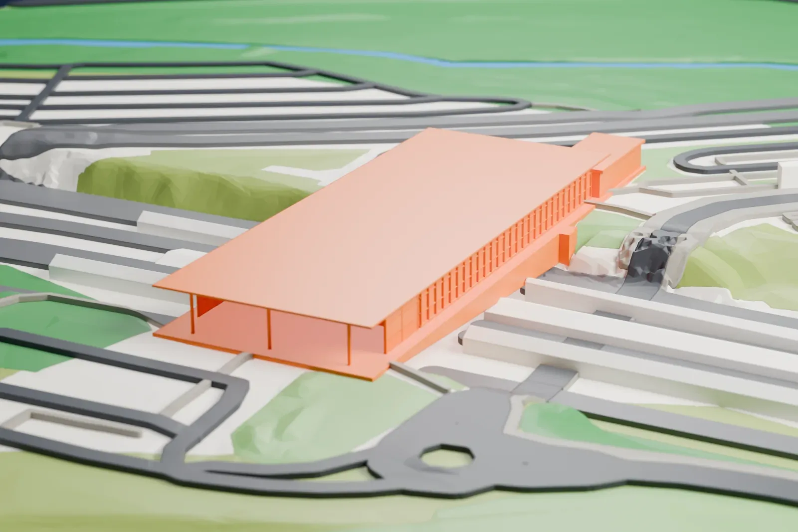 A white 3D print of Ebbsfleet International railway station among the streets and buildings of Ebbsfleet Valley.