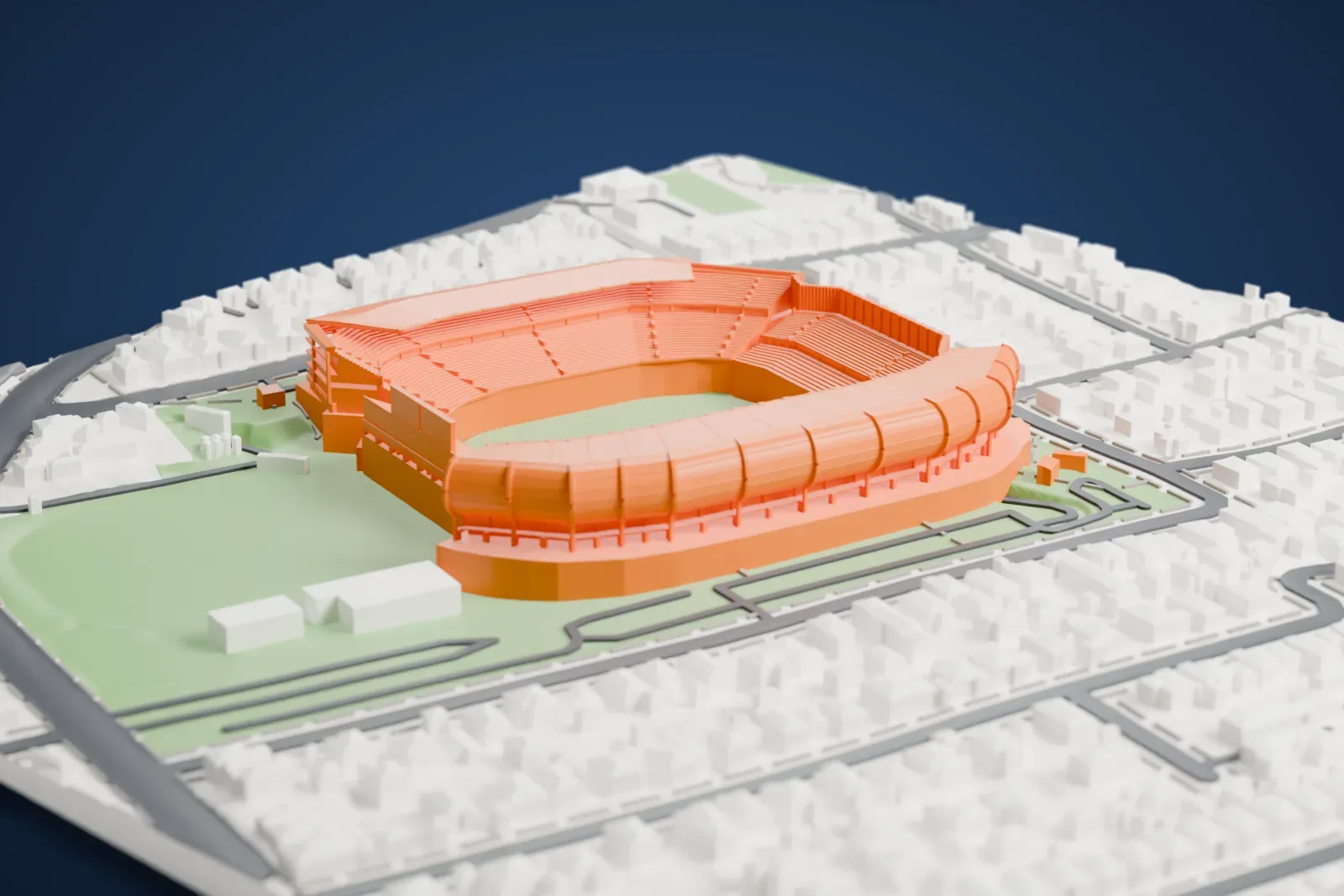 A white 3D print of Eden Park, a stadium with tiered stands and curved roof edges around a green playing field, with houses and streets around it.