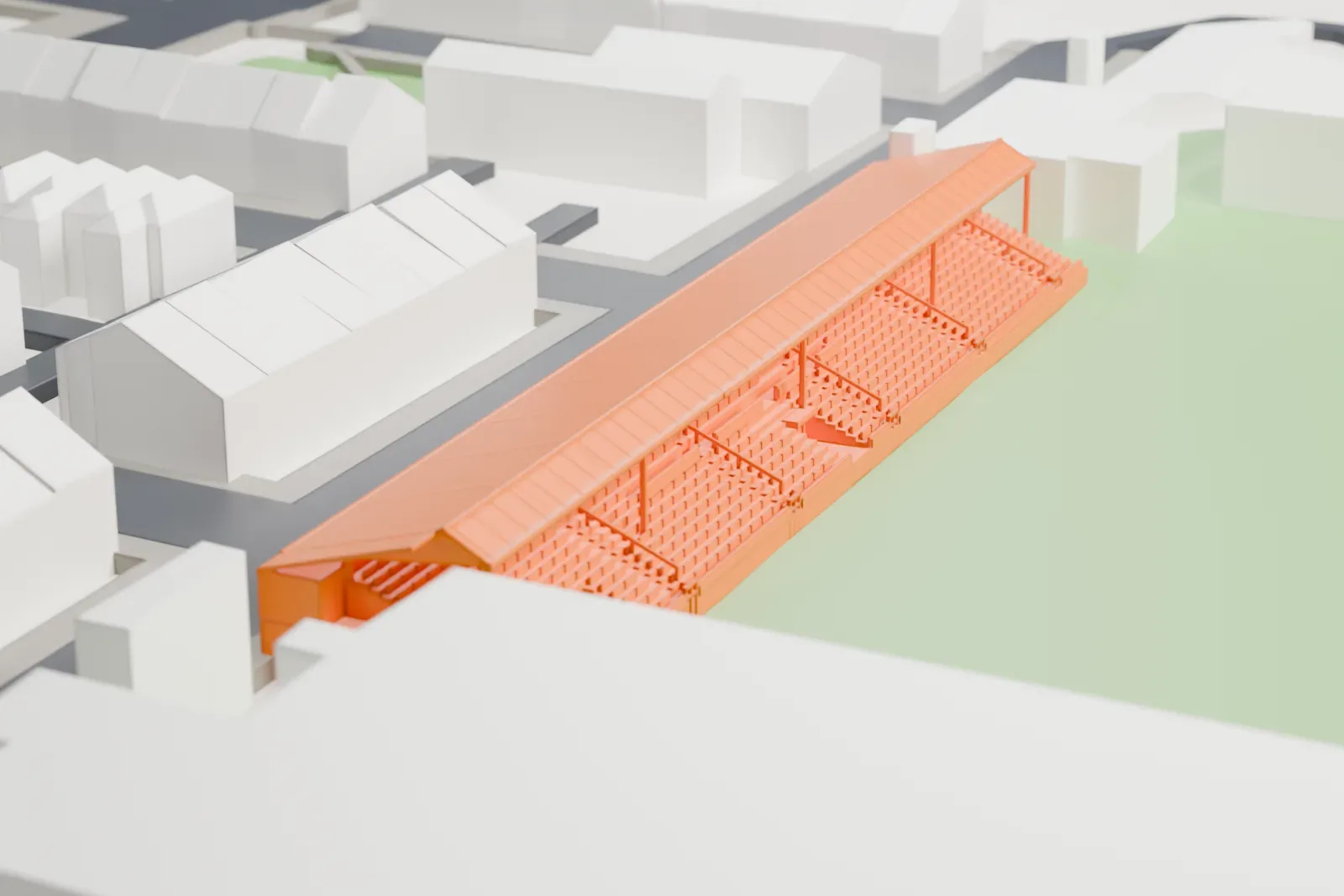 A white 3D print of Edgeley Park's main stand, with its long pitched roof and open seating, among surrounding streets and buildings.