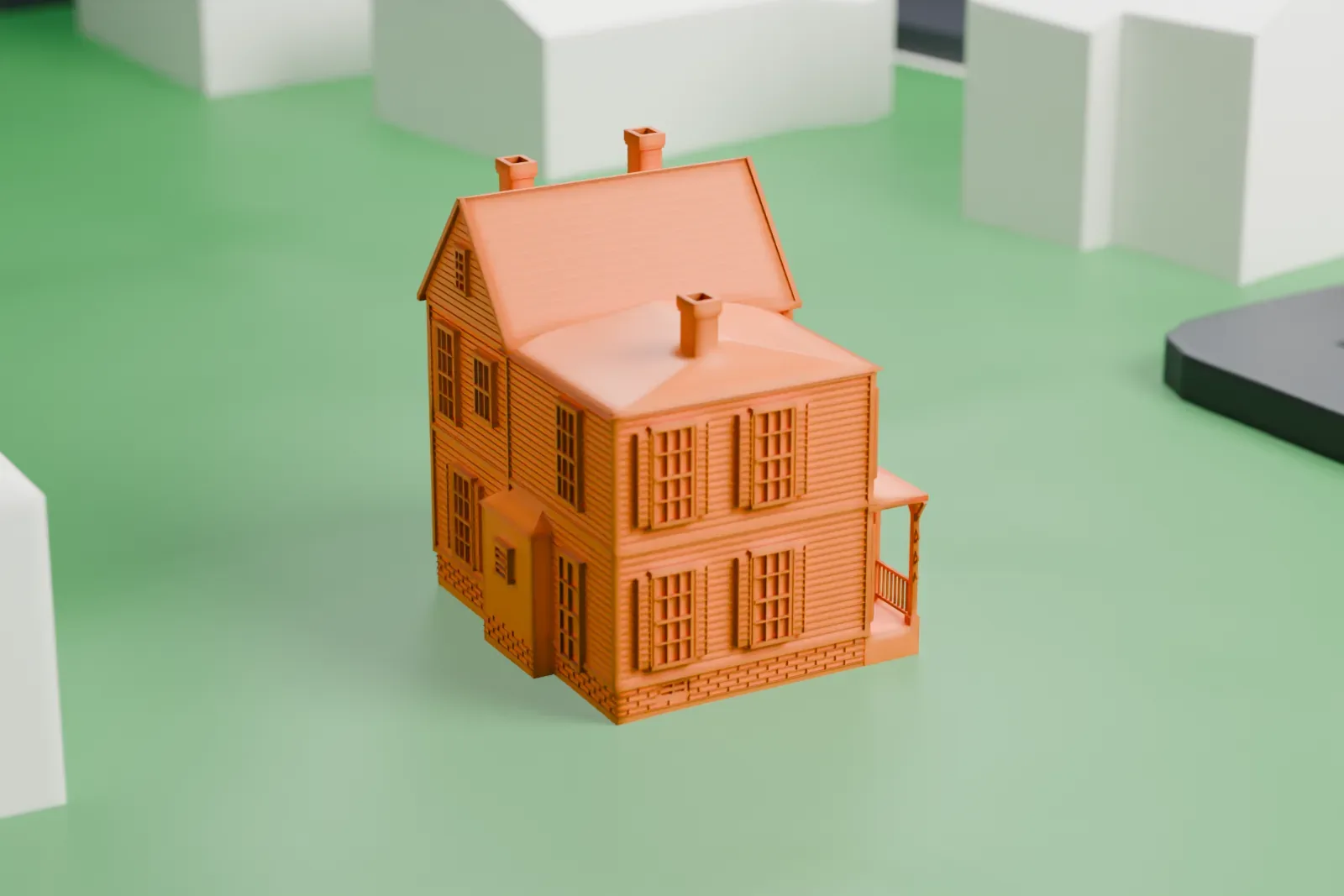A white 3D print of the Edward Hopper Birthplace and Boyhood Home, a two-story house with chimneys and a gabled addition, on a lawn with neighboring houses nearby.