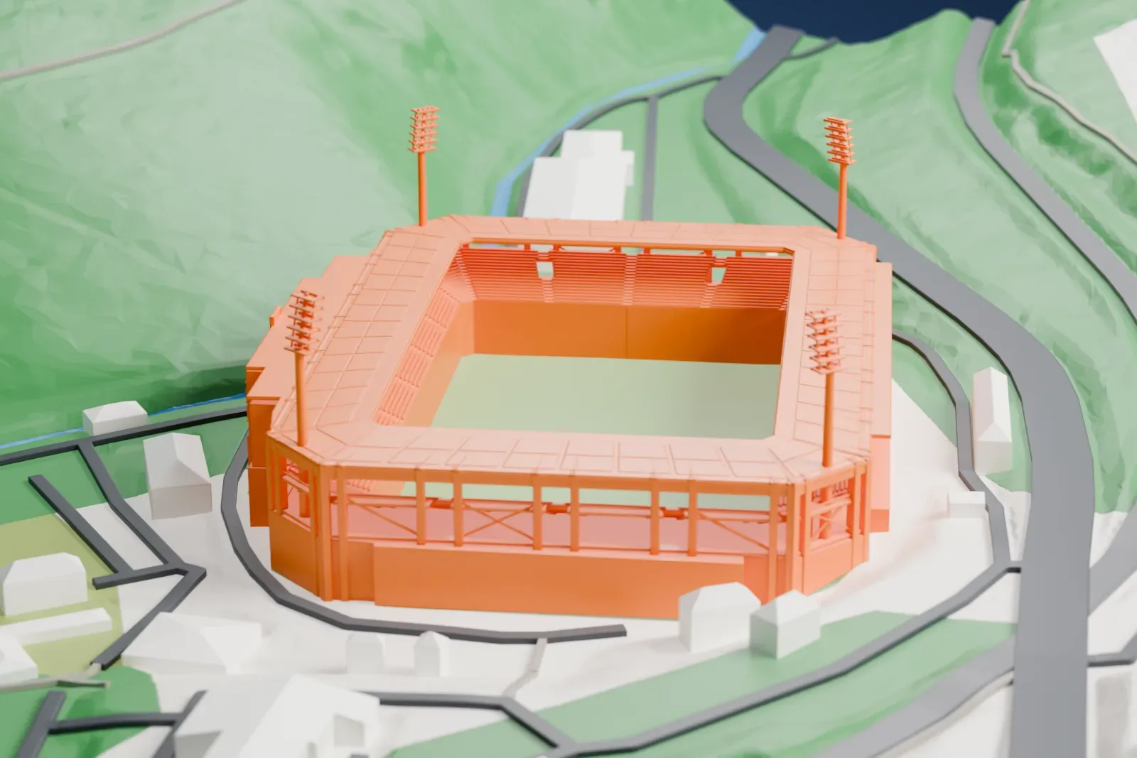 A white 3D print of Eins Erzgebirgsstadion, a rectangular football stadium with a roof around the stands and four tall floodlight masts, set on a green hillside with buildings and roads nearby.