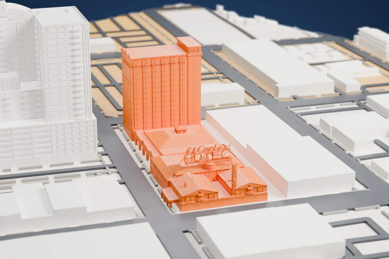 A white 3D print of El Cortez, a tall tower beside a low arcaded casino building with a rooftop sign frame, among surrounding buildings and streets.